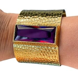 IMAN CN Gold Tone Hammered
Metal Purple Cubic Zircoina Statement
Cuff bracelet